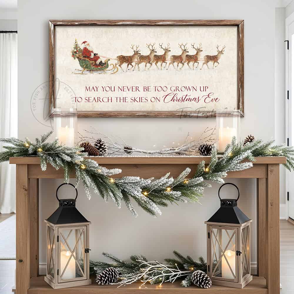 Rustic Christmas wall art featuring Santa Claus in a sleigh pulled by reindeer with the quote “May You Never Be Too Grown Up to Search the Skies on Christmas Eve.” Vintage farmhouse holiday décor perfect for adding nostalgic Christmas charm to your home.