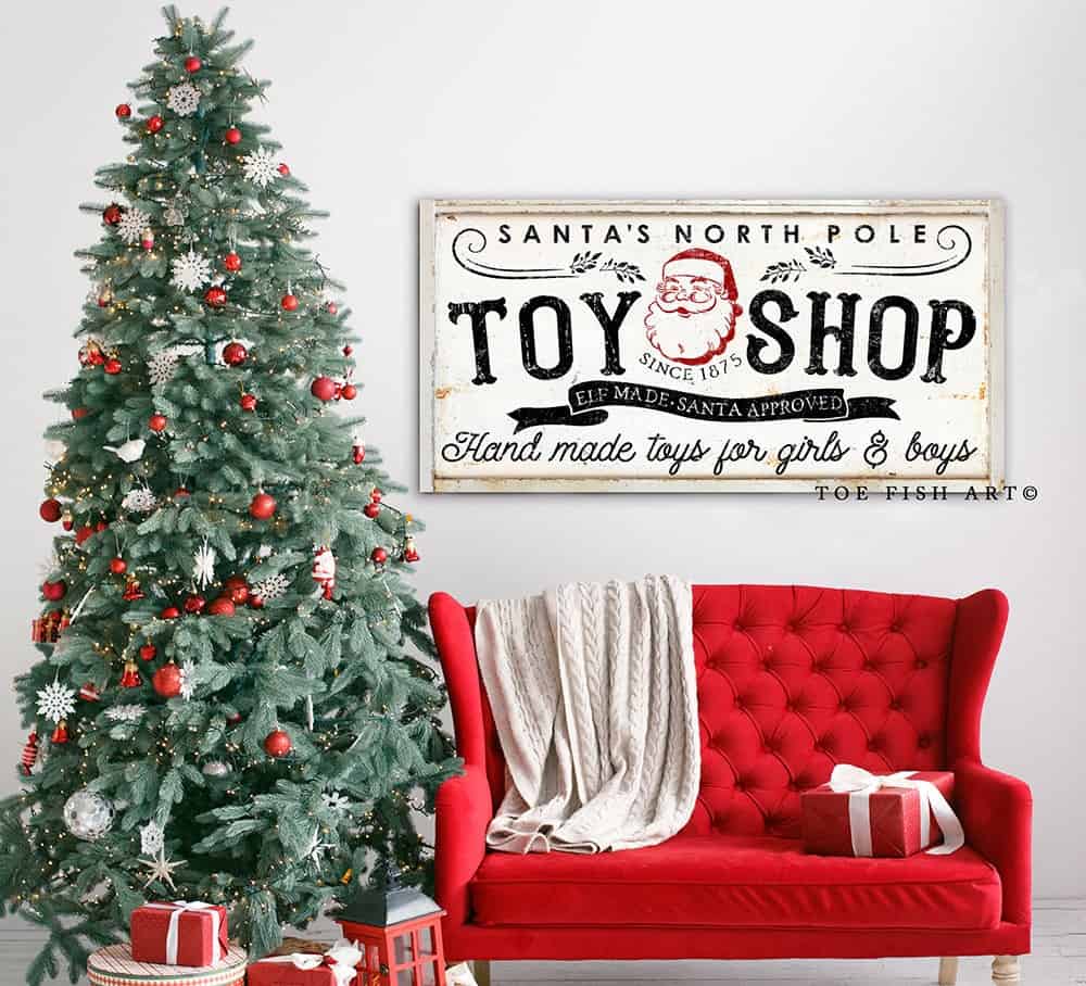 Santa's North Pole Toy Shop Sign handmade by ToeFishArt. Original, custom, personalized wall decor signs. Canvas, Wood or Metal. Rustic modern farmhouse, cottagecore, vintage, retro, industrial, Americana, primitive, country, coastal, minimalist.