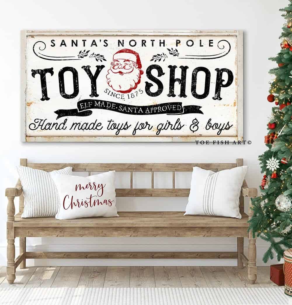 Santa's North Pole Toy Shop Sign handmade by ToeFishArt. Original, custom, personalized wall decor signs. Canvas, Wood or Metal. Rustic modern farmhouse, cottagecore, vintage, retro, industrial, Americana, primitive, country, coastal, minimalist.