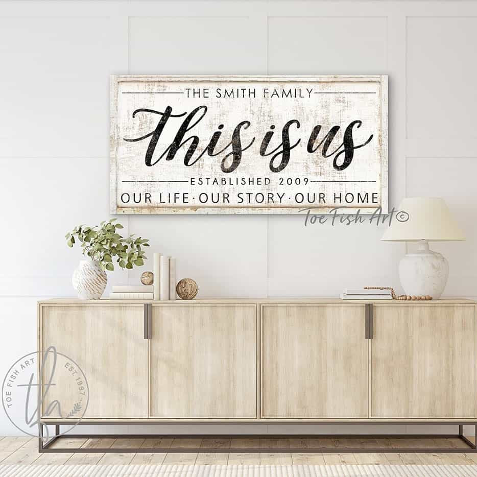 This Is Us Family Sign handmade by ToeFishArt. Original, custom, personalized wall decor signs. Canvas, Wood or Metal. Rustic modern farmhouse, cottagecore, vintage, retro, industrial, Americana, primitive, country, coastal, minimalist.