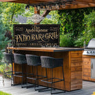 Welcome to the Patio Bar & Grill custom wall sign by Toe Fish Art, handmade in the USA in waterproof outdoor metal or framed canvas, vintage black with rustic gold, personalized family name text, and fun sayings like Kick Back-Stay Awhile, Sipping-Grilling-Chilling. Charming outdoor kitchen, bar, lounge, patio, lanai, deck, porch, or pool decor. Ideal for upgrading your outdoor summer vibe. Built to last with genuine craftsmanship, this authentic sign adds classic charm and heritage quality to any space.