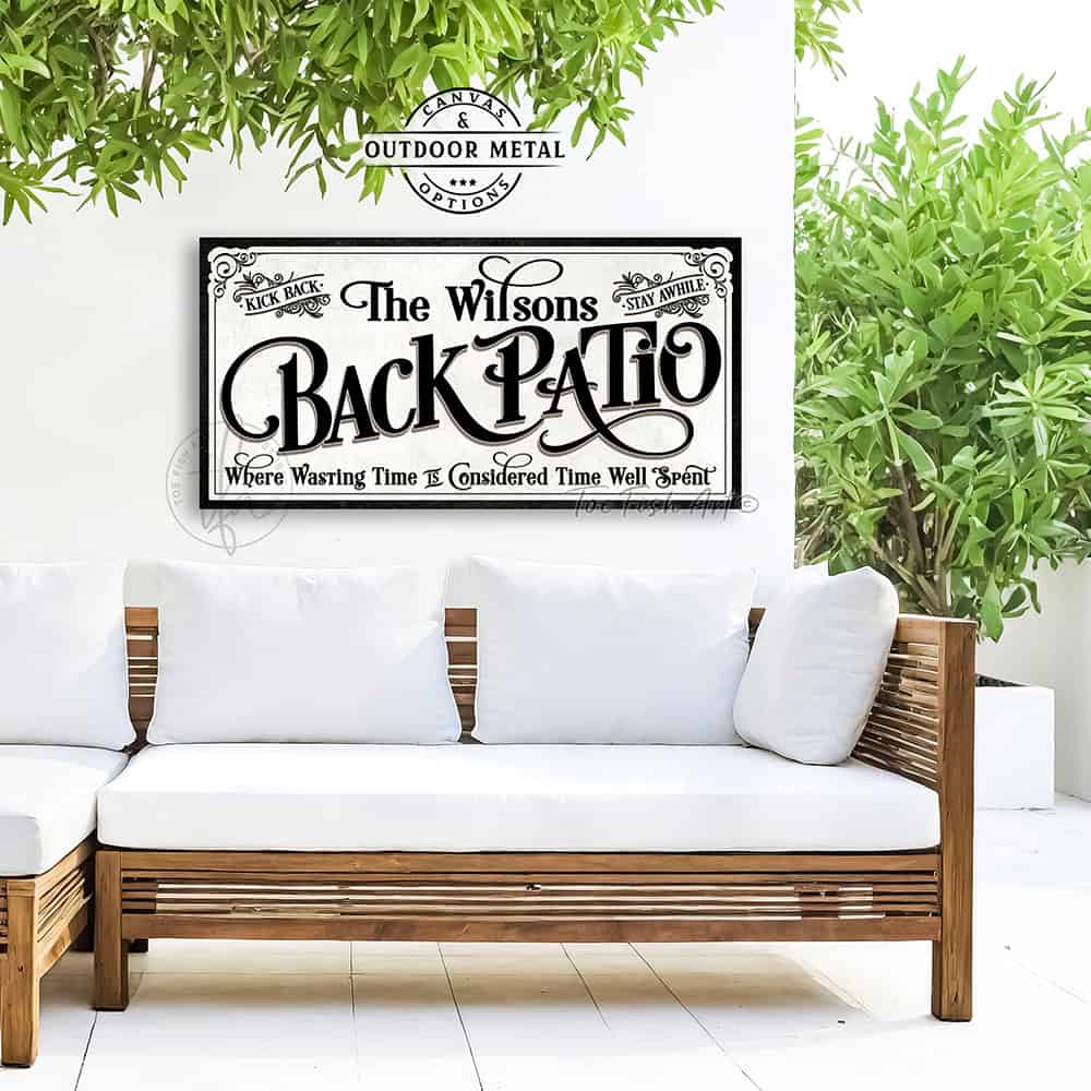 Welcome to the Back Patio personalized wall sign by Toe Fish Art in vintage black and white scroll style, available in framed canvas or waterproof outdoor metal, with custom family name and fun sayings like Kick Back, Stay Awhile, and Where Wasting Time is Considered Time Well Spent—charming backyard or patio decor handmade in the USA. Perfect for enhancing your outdoor summer decor. Built to last with genuine craftsmanship, this authentic sign adds rustic cottage charm and heritage quality to any home.