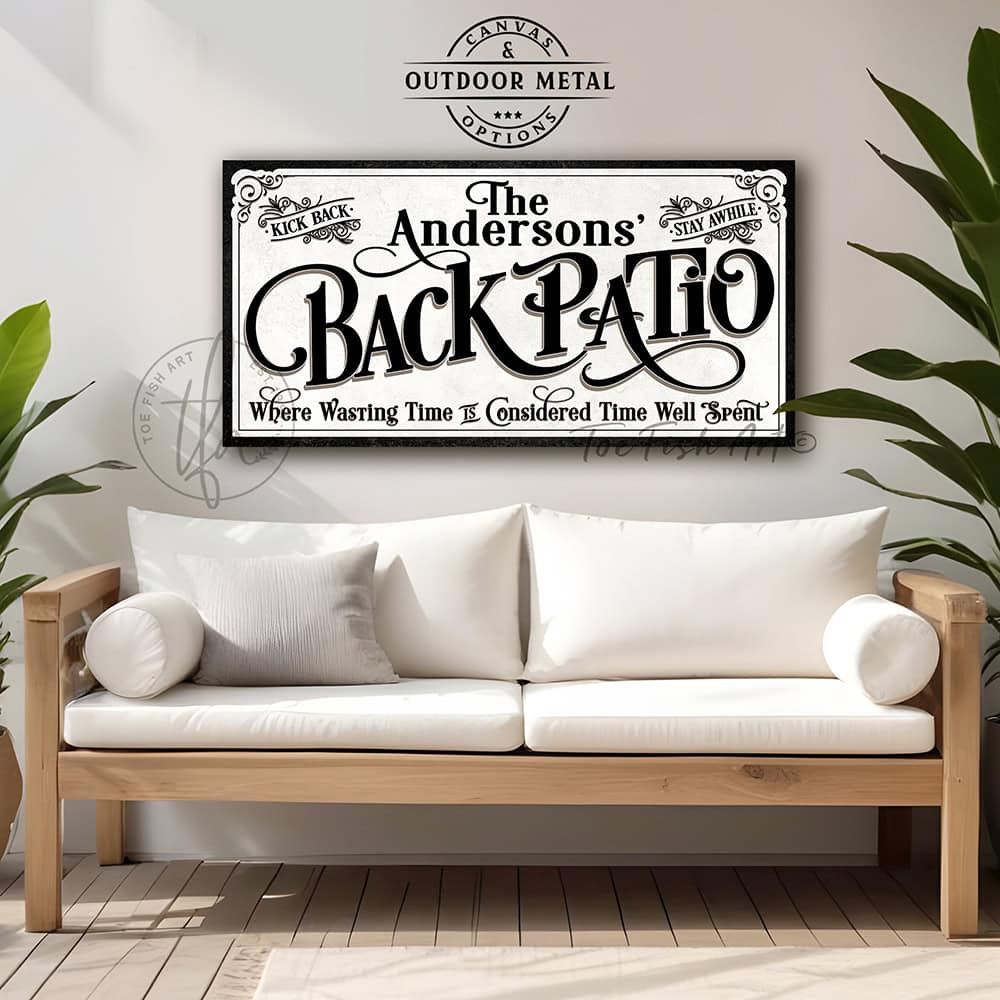 Welcome to the Back Patio personalized wall sign by Toe Fish Art in vintage black and white scroll style, available in framed canvas or waterproof outdoor metal, with custom family name and fun sayings like Kick Back, Stay Awhile, and Where Wasting Time is Considered Time Well Spent—charming backyard or patio decor handmade in the USA. Perfect for enhancing your outdoor summer decor. Built to last with genuine craftsmanship, this authentic sign adds rustic cottage charm and heritage quality to any home.