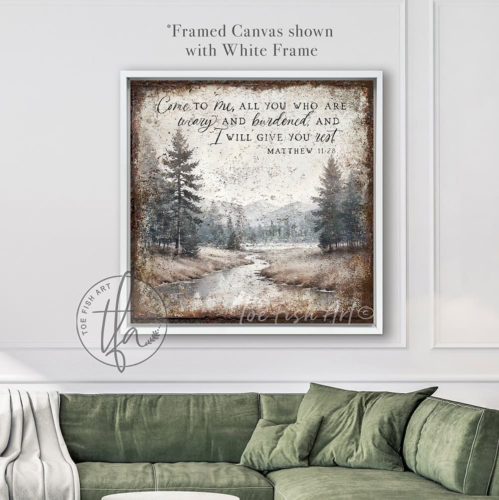 Decorate your home with words that inspire and bring peace to your space with our Vintage Scripture Wall Art 'Come To Me All Who Are Weary' Matthew 11:28, featuring a serene forested river and mountain range painting. Be surrounded by decor you LOVE! Choose premium gallery-stretched canvas or elegant framed canvas. Toe Fish Art makes artisan wall art with American materials. Proudly Made in the USA, each piece is expertly constructed with genuine craftsmanship, heritage quality, and rustic charm.