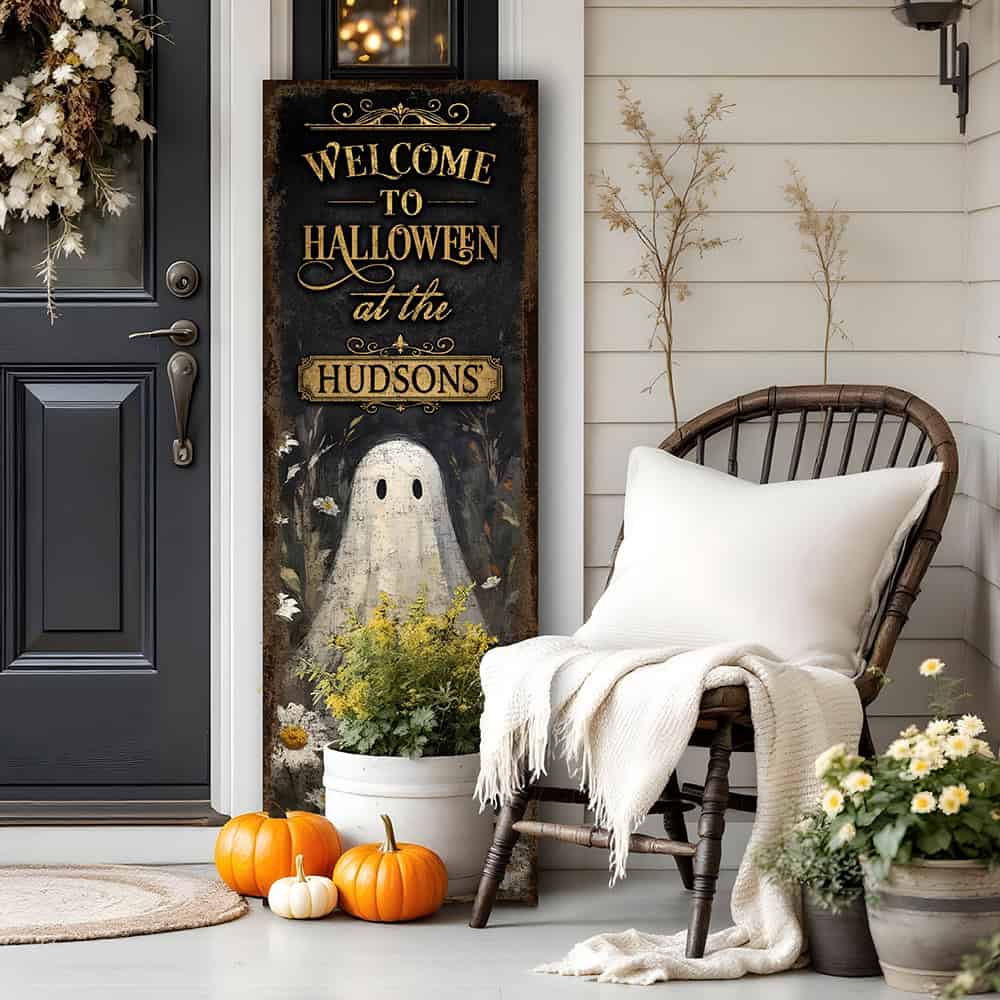 Toe Fish Art’s ‘Welcome to Halloween’ sign features a charming ghost 'pushing up daisies' in a whimsical floral design. Available as a wood-framed canvas or outdoor weatherproof metal, this vertical cottagecore-style sign is personalized with your family name and perfect for greeting guests on your front porch, entryway, or patio. Handmade in the USA and built to last with genuine craftsmanship, this rustic Halloween decor blends vintage charm with playful seasonal style for a warm and spooky welcome.
