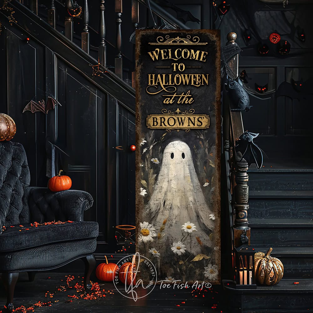 Toe Fish Art’s ‘Welcome to Halloween’ sign features a charming ghost 'pushing up daisies' in a whimsical floral design. Available as a wood-framed canvas or outdoor weatherproof metal, this vertical cottagecore-style sign is personalized with your family name and perfect for greeting guests on your front porch, entryway, or patio. Handmade in the USA and built to last with genuine craftsmanship, this rustic Halloween decor blends vintage charm with playful seasonal style for a warm and spooky welcome.