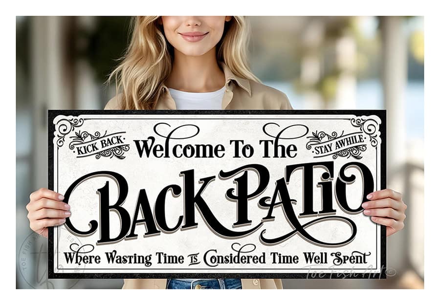 Welcome to the Back Patio personalized wall sign by Toe Fish Art in vintage black and white scroll style, available in framed canvas or waterproof outdoor metal, with custom family name and fun sayings like Kick Back, Stay Awhile, and Where Wasting Time is Considered Time Well Spent—charming backyard or patio decor handmade in the USA. Perfect for enhancing your outdoor summer decor. Built to last with genuine craftsmanship, this authentic sign adds rustic cottage charm and heritage quality to any home.