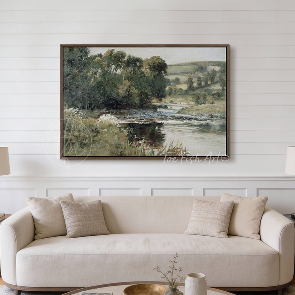 This framed landscape wall art decor by Toe Fish Art captures rural tranquility with a spring river meadow scene steeped in cottagecore tradition. The imagery balances nostalgic charm with sophisticated elegance. Available in framed canvas with choice of colors and numerous sizes to fit your space. Toe Fish Art creates artisan-made wall décor using American sourced materials. Proudly Made in the USA, each sign is expertly constructed with genuine craftsmanship, heritage quality, and rustic charm.
