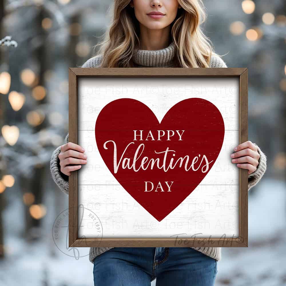 Elevate your home décor with this refined red and white Happy Valentine's Day sign, where vintage aesthetics meet contemporary design sensibility. Constructed from premium hardwood shiplap wood and finished with a natural walnut wood frame. Toe Fish Art creates quality, artisan-made wall décor with American sourced materials. Proudly Made in the USA, each sign is expertly constructed with genuine craftsmanship, heritage quality, and rustic charm.