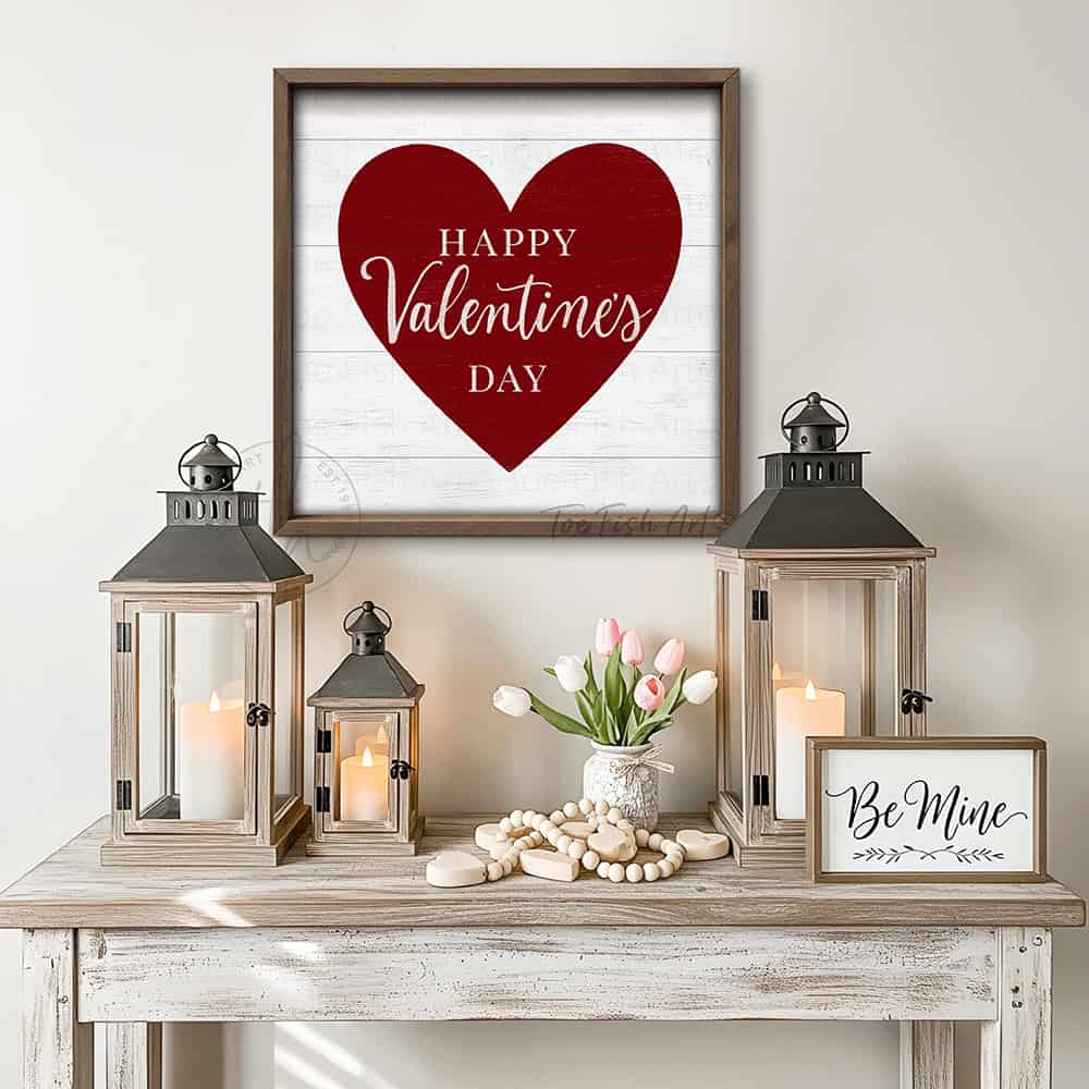 Elevate your home décor with this refined red and white Happy Valentine's Day sign, where vintage aesthetics meet contemporary design sensibility. Constructed from premium hardwood shiplap wood and finished with a natural walnut wood frame. Toe Fish Art creates quality, artisan-made wall décor with American sourced materials. Proudly Made in the USA, each sign is expertly constructed with genuine craftsmanship, heritage quality, and rustic charm.