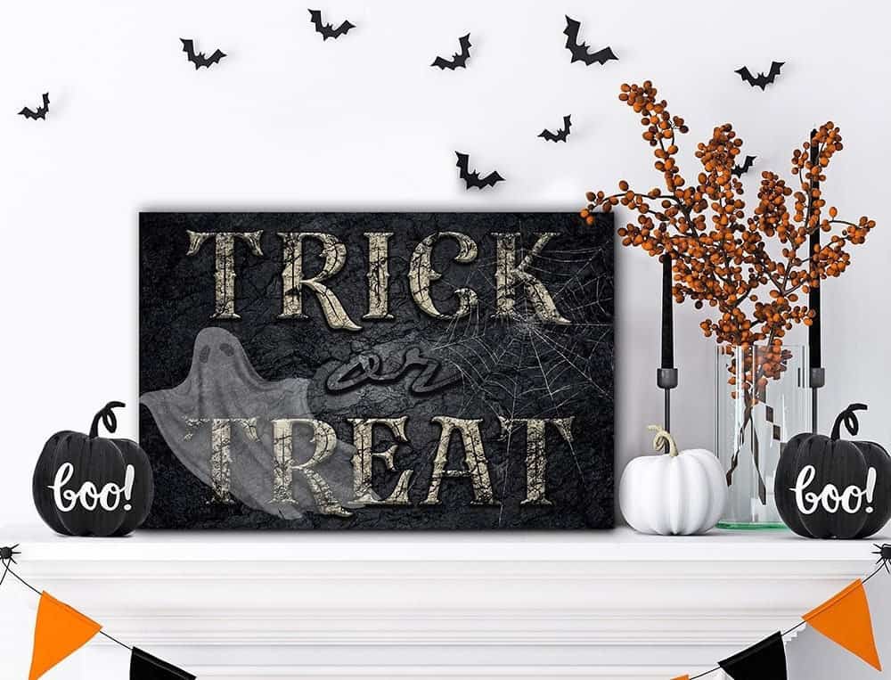 Trick or Treat Ghost Sign handmade by ToeFishArt. Trick or Treat Ghost Sign handcrafted in the USA in Indoor Canvas or Outdoor Metal for the ultimate Halloween Home Decor. Original, custom, personalized wall decor signs. Canvas, Wood or Metal. Rustic modern farmhouse, cottagecore, vintage, retro, industrial, Americana, primitive, country, coastal, minimalist.