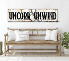 Uncork & Unwind Rustic Sign handmade by ToeFishArt. Original, custom, personalized wall decor signs. Canvas, Wood or Metal. Rustic modern farmhouse, cottagecore, vintage, retro, industrial, Americana, primitive, country, coastal, minimalist.