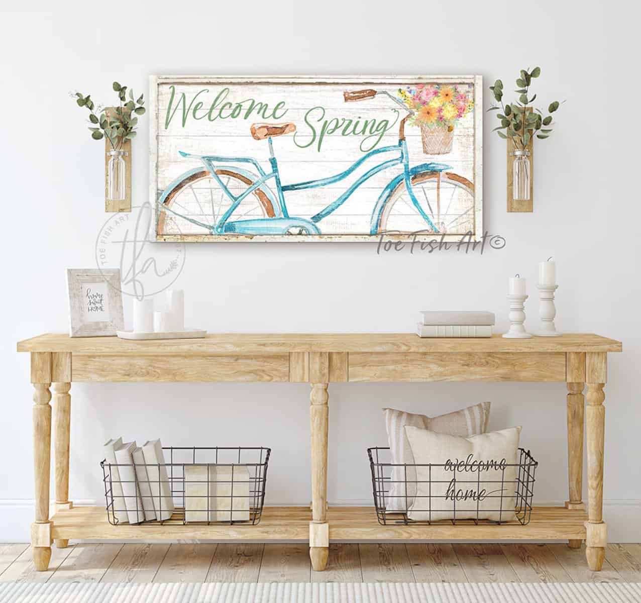 Welcome Spring Sign, Beautiful Blue Bicycle Fresh Flowers Artwork in Minimalist Vintage Coastal Farmhouse Style handmade by ToeFishArt. Original, custom, personalized wall decor signs. Canvas, Wood or Metal. Rustic modern farmhouse, cottagecore, vintage, retro, industrial, Americana, primitive, country, coastal, minimalist.