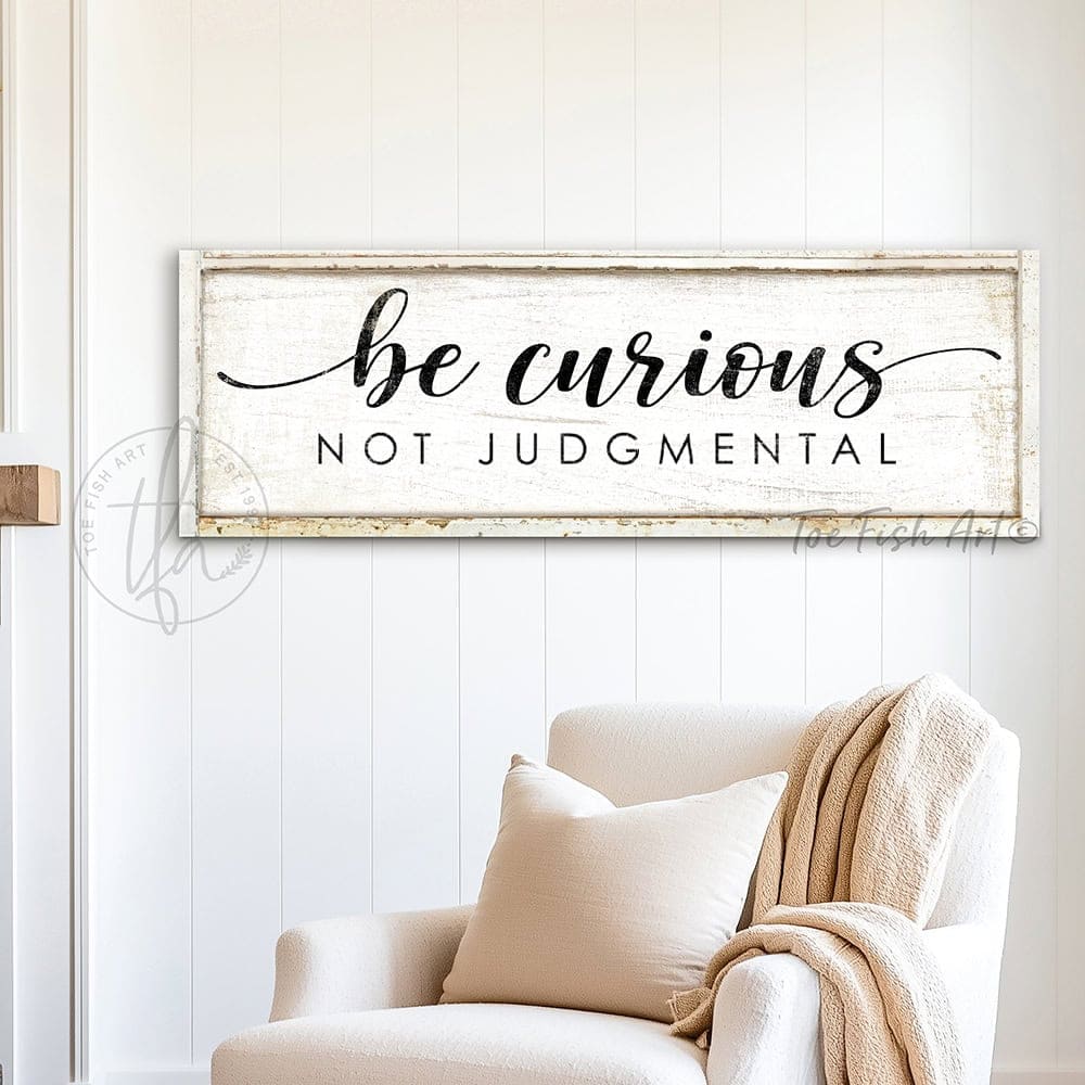 "Be Curious Not Judgmental" invites you to live with intention. This modern farmhouse wall art by Toe Fish Art serves as a reminder to approach life with kindness. Featuring neutral vintage tones that complement any space. Be surrounded by decor you LOVE! Choose premium gallery-stretched canvas or elegant framed canvas. Toe Fish Art makes artisan wall art with American materials. Proudly Made in the USA, each piece is expertly constructed with genuine craftsmanship, heritage quality, and rustic charm.