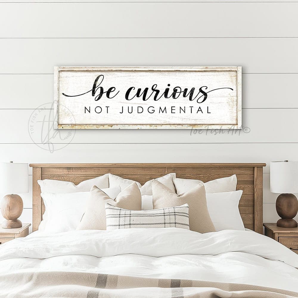 "Be Curious Not Judgmental" invites you to live with intention. This modern farmhouse wall art by Toe Fish Art serves as a reminder to approach life with kindness. Featuring neutral vintage tones that complement any space. Be surrounded by decor you LOVE! Choose premium gallery-stretched canvas or elegant framed canvas. Toe Fish Art makes artisan wall art with American materials. Proudly Made in the USA, each piece is expertly constructed with genuine craftsmanship, heritage quality, and rustic charm.