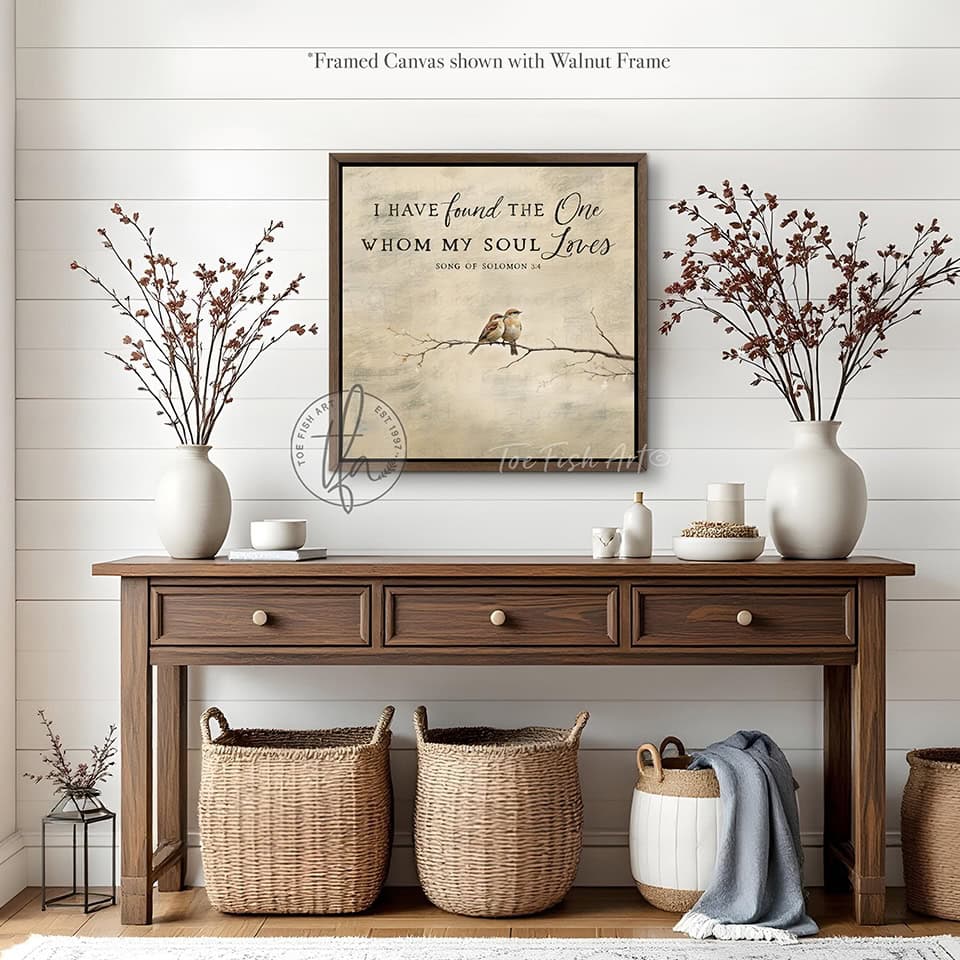 This faith-based wall decor brings the message "I Have Found the One Whom My Soul Loves" to your home through a quaint depiction of two love birds sharing a quiet moment in this square-shaped wall art. The painting conveys a sense of peace, calm, and connection. Choose between premium framed canvas or durable outdoor metal. Toe Fish Art makes artisan wall art with American materials. Proudly Made in the USA, each piece is expertly constructed with genuine craftsmanship, heritage quality, and rustic charm.
