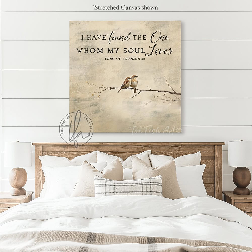 This faith-based wall decor brings the message "I Have Found the One Whom My Soul Loves" to your home through a quaint depiction of two love birds sharing a quiet moment in this square-shaped wall art. The painting conveys a sense of peace, calm, and connection. Choose between premium framed canvas or durable outdoor metal. Toe Fish Art makes artisan wall art with American materials. Proudly Made in the USA, each piece is expertly constructed with genuine craftsmanship, heritage quality, and rustic charm.