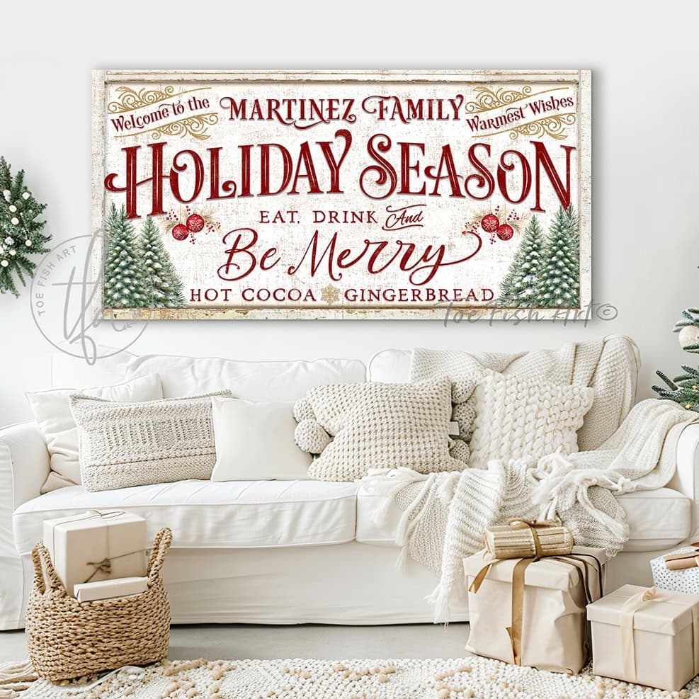 This personalized vintage Christmas sign handcrafted in the USA by Toe Fish Art features "Welcome to the (your family name) Holiday Season" with the festive phrase "Eat, Drink & Be Merry" in a warm palette of red, green, gold, and cream—perfect for creating an inviting atmosphere all season long.