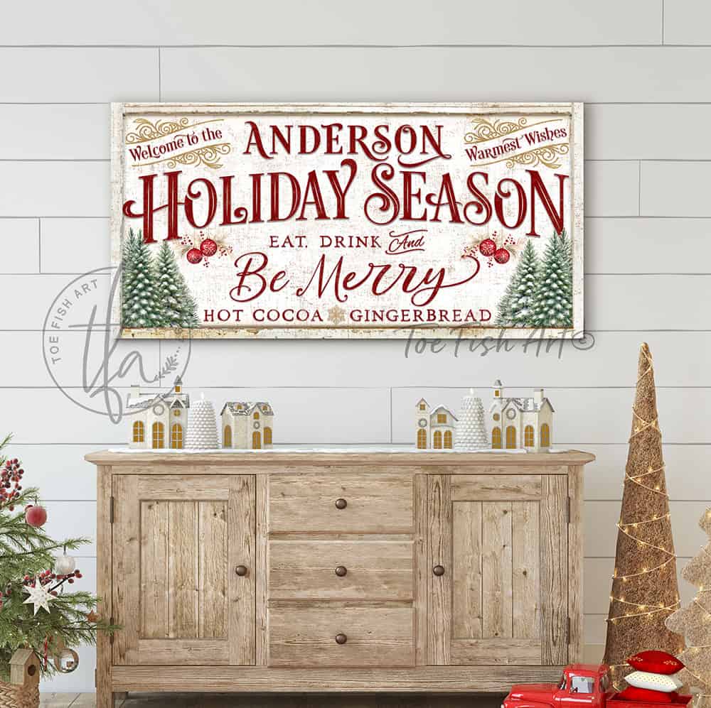 This personalized vintage Christmas sign handcrafted in the USA by Toe Fish Art features "Welcome to the (your family name) Holiday Season" with the festive phrase "Eat, Drink & Be Merry" in a warm palette of red, green, gold, and cream—perfect for creating an inviting atmosphere all season long.