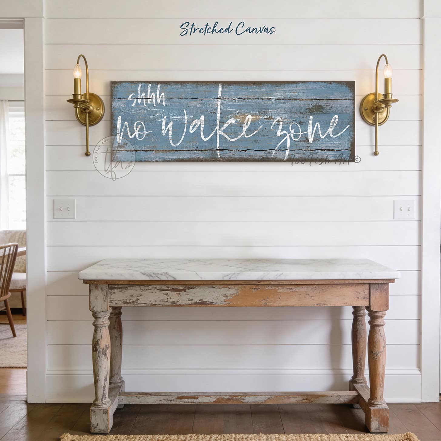 Bring laid-back lake life to your space with Toe Fish Art's "Shhh… No Wake Zone" sign. Featuring a weathered rustic blue finish, hand-lettered white typography, and the look of reclaimed wood, this timeless but trendy design adds relaxed coastal vibes. Choose between premium framed canvas or durable outdoor metal. Toe Fish Art makes artisan wall art with American materials. Proudly Made in the USA, each piece is expertly constructed with genuine craftsmanship, heritage quality, and rustic charm.