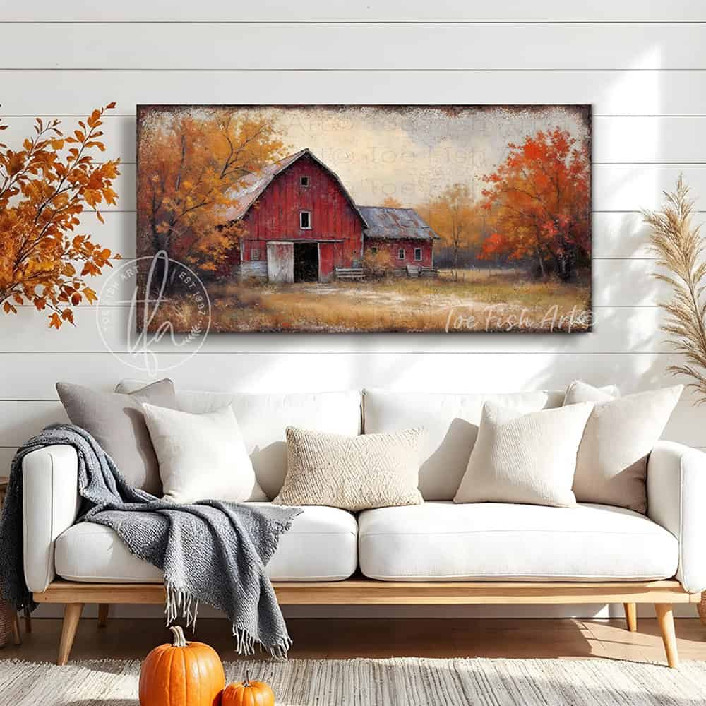 Bring home the beauty of an autumn countryside with the vibrant fall colors of this Vintage Red Barn Wall Art by Toe Fish Art, featuring a rustic red barn on a country lane with colorful fall foliage set beneath a peaceful autumn sky. Toe Fish Art specializes in Holiday and Seasonal home decor for indoor and outdoor living spaces, in framed canvas, hardwood shiplap, or outdoor metal. Each piece is expertly constructed by American artisans with genuine craftsmanship, heritage quality, and rustic charm.