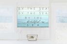 By the Sea Sign handmade by ToeFishArt. Original, custom, personalized wall decor signs. Canvas, Wood or Metal. Rustic modern farmhouse, cottagecore, vintage, retro, industrial, Americana, primitive, country, coastal, minimalist.