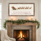 Rustic Christmas wall art featuring Santa Claus in a sleigh pulled by reindeer with the quote “May You Never Be Too Grown Up to Search the Skies on Christmas Eve.” Vintage farmhouse holiday décor perfect for adding nostalgic Christmas charm to your home.