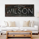 Personalized Family Name Sign with First and Last Names, Established Date, and Custom Wording Options, handmade by Toe Fish Art. Be surrounded by decor you LOVE! Choose between premium framed canvas or durable outdoor metal. Toe Fish Art makes artisan wall art with American materials. Proudly Made in the USA, each piece is expertly constructed with genuine craftsmanship, heritage quality, and rustic charm.