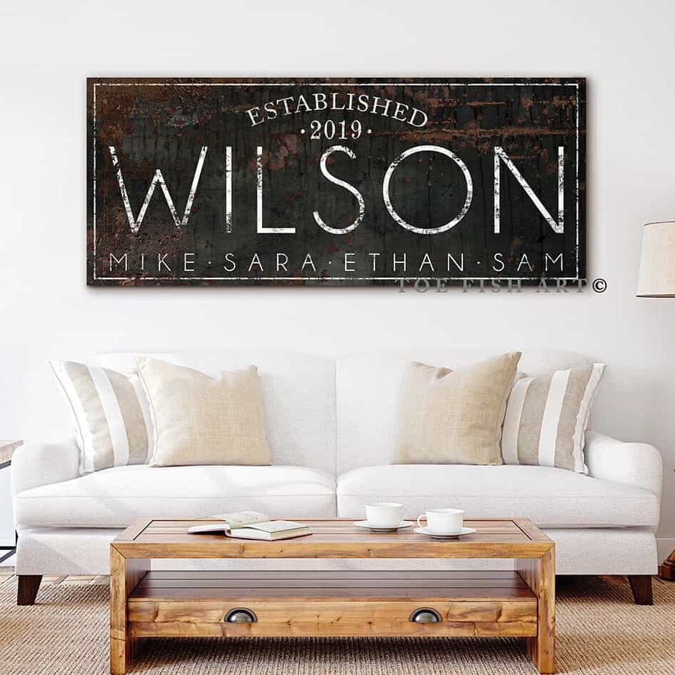 Personalized Family Name Sign with First and Last Names, Established Date, and Custom Wording Options, handmade by Toe Fish Art. Be surrounded by decor you LOVE! Choose between premium framed canvas or durable outdoor metal. Toe Fish Art makes artisan wall art with American materials. Proudly Made in the USA, each piece is expertly constructed with genuine craftsmanship, heritage quality, and rustic charm.