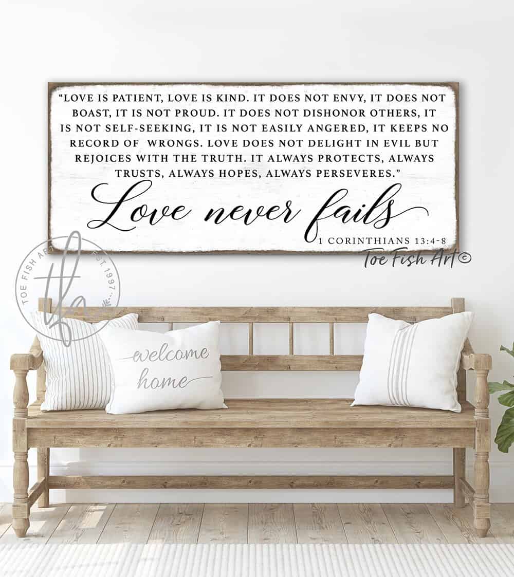 Love Never Fails Sign handmade by ToeFishArt. Original, custom, personalized wall decor signs. Canvas, Wood or Metal. Rustic modern farmhouse, cottagecore, vintage, retro, industrial, Americana, primitive, country, coastal, minimalist.