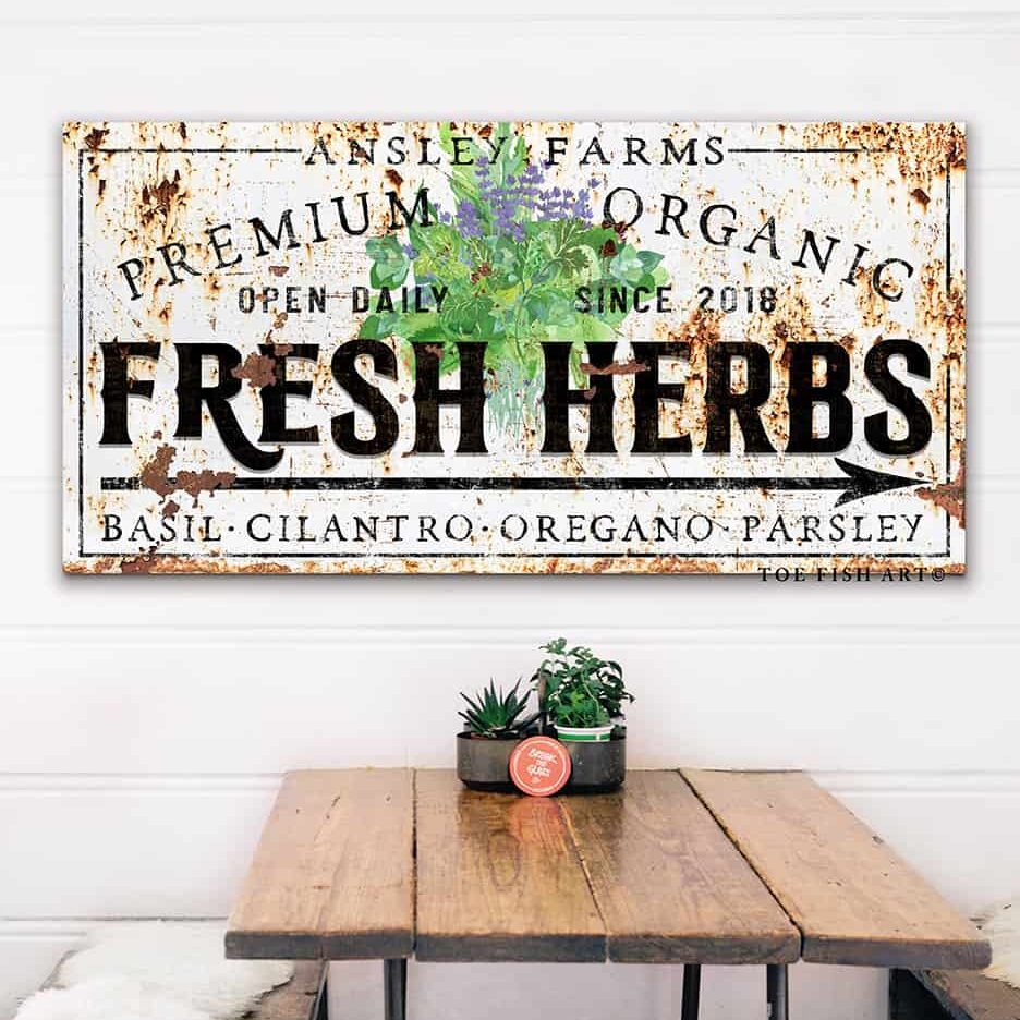 Personalized fresh herbs farmhouse sign with vintage typography and greenery design, available in canvas or outdoor metal wall art, rustic kitchen or garden decor customized with family name and date, cottage style wall sign. Be surrounded by decor you LOVE! Choose between premium framed canvas or durable outdoor metal. Toe Fish Art makes artisan wall art with American materials. Proudly Made in the USA, each piece is expertly constructed with genuine craftsmanship, heritage quality, and rustic charm.
