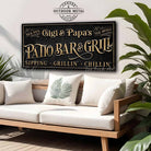Welcome to the Patio Bar & Grill custom wall sign by Toe Fish Art, handmade in the USA in waterproof outdoor metal or framed canvas, vintage black with rustic gold, personalized family name text, and fun sayings like Kick Back-Stay Awhile, Sipping-Grilling-Chilling. Charming outdoor kitchen, bar, lounge, patio, lanai, deck, porch, or pool decor. Ideal for upgrading your outdoor summer vibe. Built to last with genuine craftsmanship, this authentic sign adds classic charm and heritage quality to any space.