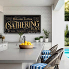 Toe Fish Art's customizable Gathering Place Sign available in framed canvas or outdoor waterproof metal, featuring fun wording options and personalized family name text. Designed in vintage black with rustic gold-style lettering for a sleek, classy look that fits any indoor or outdoor setting. This stylish wall decor is perfect for patios, porches, or entertaining spaces. Handmade in the USA and built to last with genuine craftsmanship, ideal for adding personality to your favorite gathering place.