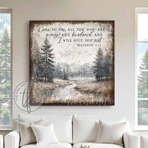 Decorate your home with words that inspire and bring peace to your space with our Vintage Scripture Wall Art 'Come To Me All Who Are Weary' Matthew 11:28, featuring a serene forested river and mountain range painting. Be surrounded by decor you LOVE! Choose premium gallery-stretched canvas or elegant framed canvas. Toe Fish Art makes artisan wall art with American materials. Proudly Made in the USA, each piece is expertly constructed with genuine craftsmanship, heritage quality, and rustic charm.