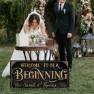 Welcome to Our Beginning personalized vintage-inspired wedding sign by Toe Fish Art, featuring couple’s names and date, gorgeous vintage black background with rustic gold lettering, available as framed canvas or outdoor waterproof metal — a unique, rustic chic wedding ceremony and reception keepsake decoration, designed and handcrafted in the USA. Ideal for indoor and outdoor spaces. Built to last with genuine craftsmanship, this authentic sign adds classic charm and heritage quality to your special day.