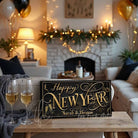 This personalized Happy New Year decoration sign by Toe Fish Art evokes the opulence of 1920s Paris, blending gold elegance with sleek black sophistication. Available in framed canvas or weather-resistant outdoor metal, perfect for any setting—from intimate home displays to outdoor entertaining. Customize this sign to reflect your personal style or celebration theme. Transform your space into a venue worthy of champagne toasts and cherished moments.