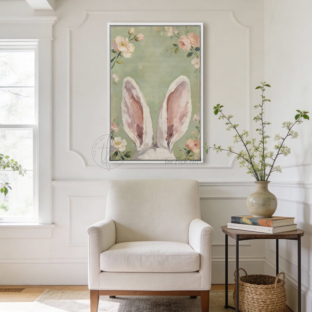 Hop into spring with this vintage floral bunny wall decor by Toe Fish Art! Using soft green and pink pastels, this cottagecore artwork brings a playful vibe with adorable bunny ears peeking up through flowers. Whether decorating a cozy bedroom, nursery, or Easter festivities and gifts, this framed piece brings instant charm. Toe Fish Art makes artisan wall décor using American sourced materials. Proudly Made in the USA and expertly constructed with genuine craftsmanship, heritage quality, and rustic charm.