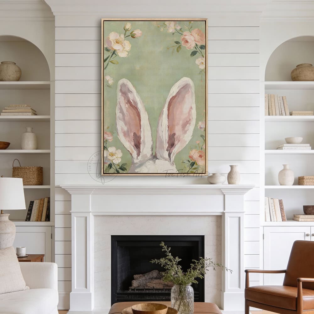 Hop into spring with this vintage floral bunny wall decor by Toe Fish Art! Using soft green and pink pastels, this cottagecore artwork brings a playful vibe with adorable bunny ears peeking up through flowers. Whether decorating a cozy bedroom, nursery, or Easter festivities and gifts, this framed piece brings instant charm. Toe Fish Art makes artisan wall décor using American sourced materials. Proudly Made in the USA and expertly constructed with genuine craftsmanship, heritage quality, and rustic charm.