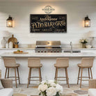 Welcome guests to your outdoor entertaining space with this personalized patio bar and grill sign by Toe Fish Art. Customize with your family name, clever welcome phrase, or business name to create distinctive decor for your deck, outdoor kitchen, or poolside bar. Available in outdoor metal or canvas. Toe Fish Art creates artisan-made wall décor using American sourced materials. Proudly Made in the USA, each sign is expertly constructed with genuine craftsmanship, heritage quality, and rustic charm.