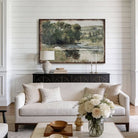 This landscape artwork by Toe Fish Art captures rural tranquility with a spring river meadow scene steeped in cottagecore tradition. The imagery balances nostalgic charm with sophisticated elegance. Available in framed canvas or weather-resistant outdoor metal in numerous sizes to fit your space. Toe Fish Art creates artisan-made wall décor using American sourced materials. Proudly Made in the USA, each sign is expertly constructed with genuine craftsmanship, heritage quality, and rustic charm.