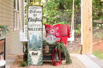 Bring home the Holidays with the beautiful winter colors of this Personalized Welcome to Christmas Porch Sign by Toe Fish Art. This stunning porch leaner or front door wall hanging features a nostalgic winter sleigh ride scene and custom personalization. Toe Fish Art specializes in Holiday and Seasonal home decor for indoor and outdoor spaces. Framed canvas, hardwood shiplap, or outdoor metal. Each piece is expertly made by American artisans with genuine craftsmanship, heritage quality, and rustic charm.