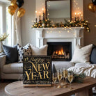 Toe Fish Art Gold and black Happy New Year wall art with champagne glasses, fireworks, and “Cheers to New Beginnings” text design.