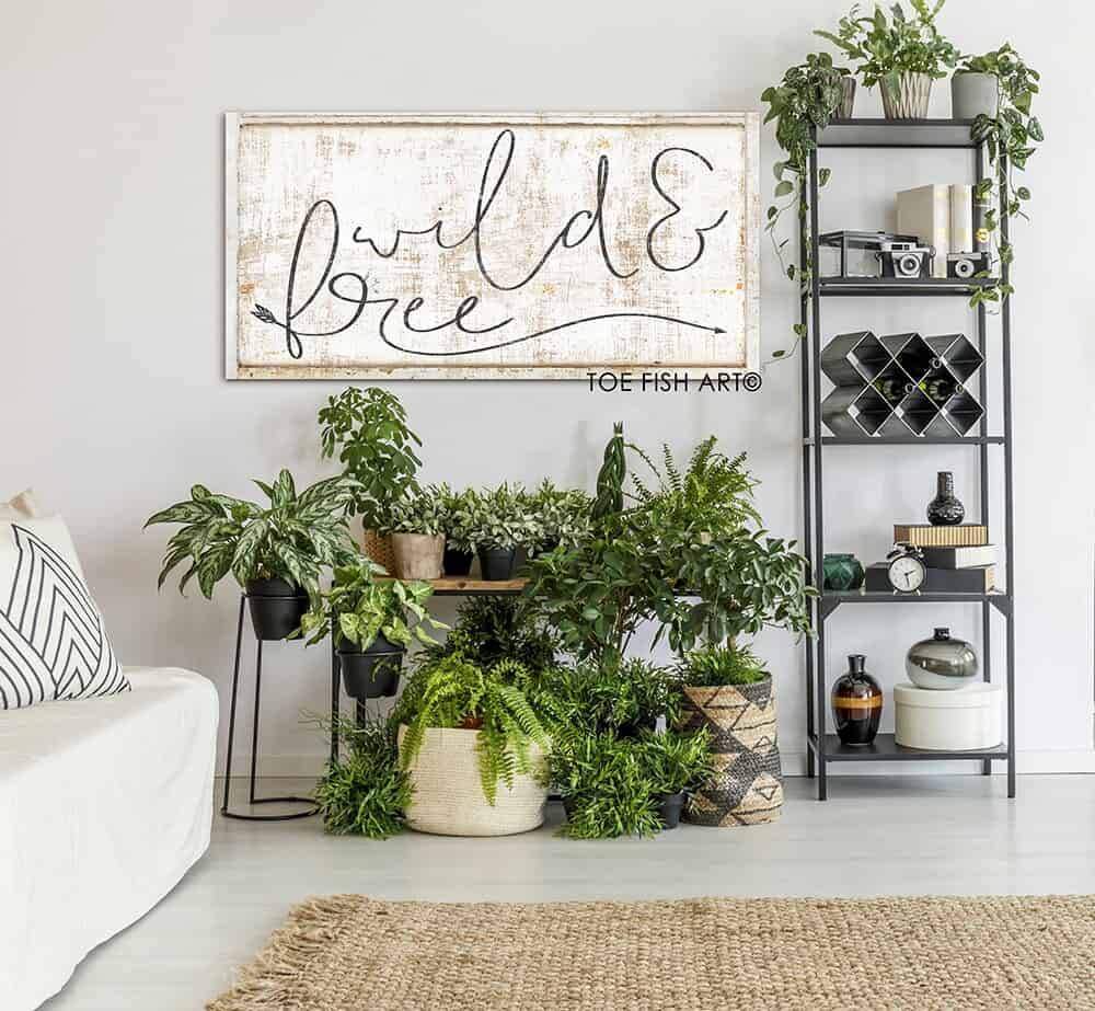 Wild & Free Sign handmade by ToeFishArt. Original, custom, personalized wall decor signs. Canvas, Wood or Metal. Rustic modern farmhouse, cottagecore, vintage, retro, industrial, Americana, primitive, country, coastal, minimalist.