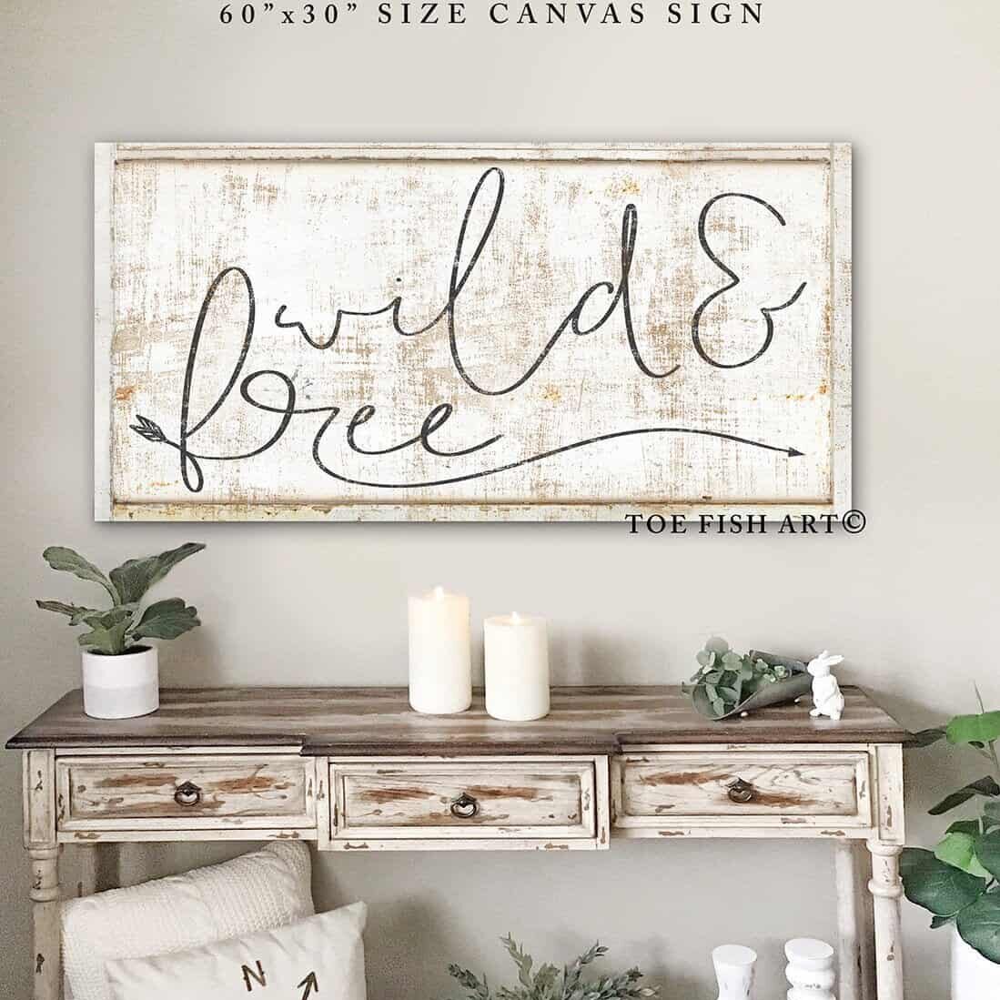 Wild & Free Sign handmade by ToeFishArt. Original, custom, personalized wall decor signs. Canvas, Wood or Metal. Rustic modern farmhouse, cottagecore, vintage, retro, industrial, Americana, primitive, country, coastal, minimalist.