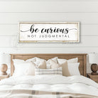 "Be Curious Not Judgmental" invites you to live with intention. This modern farmhouse wall art by Toe Fish Art serves as a reminder to approach life with kindness. Featuring neutral vintage tones that complement any space. Be surrounded by decor you LOVE! Choose premium gallery-stretched canvas or elegant framed canvas. Toe Fish Art makes artisan wall art with American materials. Proudly Made in the USA, each piece is expertly constructed with genuine craftsmanship, heritage quality, and rustic charm.