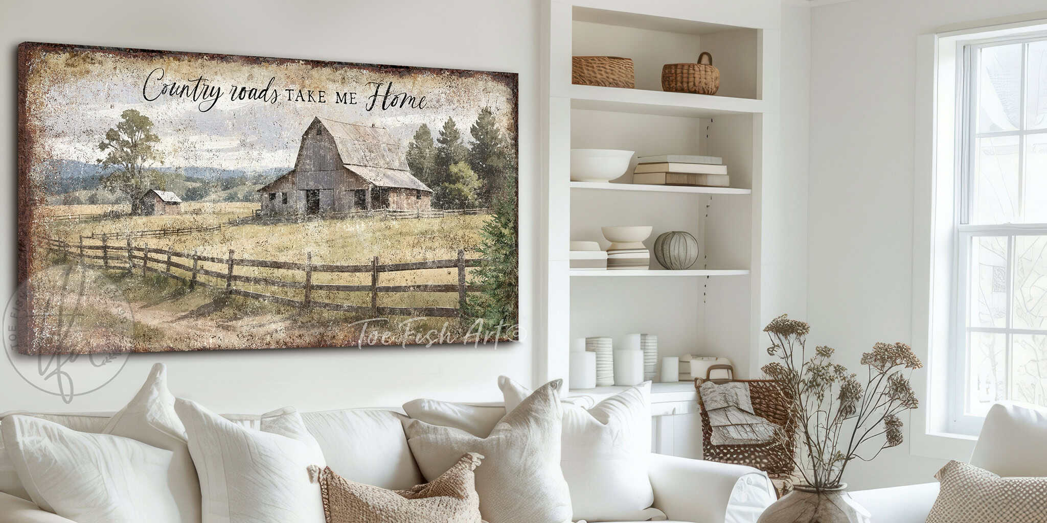 The cottagecore charm of Toe Fish Art's "Vintage Barn Country Roads Take Me Home" wall art is a stunning farmhouse landscape painting that captures a picturesque rustic barn set against rolling hills and a tranquil sky. Be surrounded by decor you LOVE! Choose between premium framed canvas or durable outdoor metal. Toe Fish Art makes artisan wall art with American materials. Proudly Made in the USA, each piece is expertly constructed with genuine craftsmanship, heritage quality, and rustic charm.