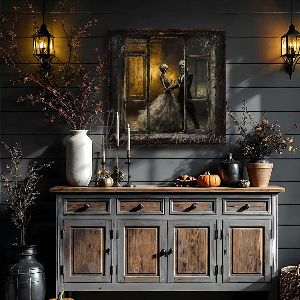 Team up with Toe Fish Art to create the ultimate Fall display with this Dancing Skeletons Halloween Gothic wall art statement piece. Gaze through a rustic, cobweb-covered window as elegantly dressed skeletons dance by candlelight, evoking a vintage romance feel. Choose between premium framed canvas or durable outdoor metal. Toe Fish Art makes artisan wall art with American materials. Proudly Made in the USA, each piece is expertly constructed with genuine craftsmanship, heritage quality, and rustic charm.