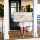 Bring coastal serenity into your home with this stunning Ocean Wave Wall Art exclusively by Toe Fish Art. The color palette is serene neutral tones—soft creams, warm grays, and natural sand hues—with luminous golden sunlight. Be surrounded by decor you LOVE! Choose premium framed canvas or durable outdoor metal. Toe Fish Art makes artisan wall art with American materials. Proudly Made in the USA, each piece is expertly constructed with genuine craftsmanship, heritage quality, and rustic charm.