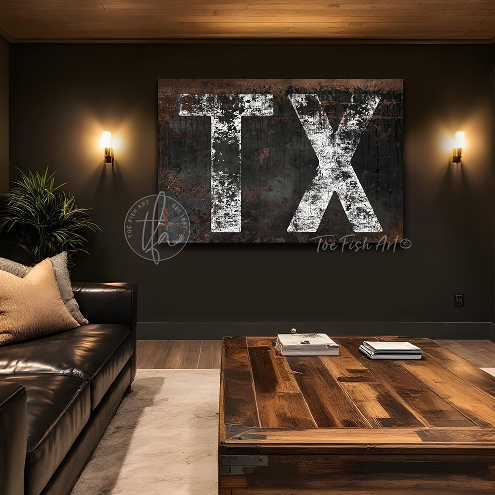 Personalized USA state location wall art featuring your custom two-letter state abbreviation on a dark, distressed industrial farmhouse background with vintage rustic charm and faded white lettering. Be surrounded by decor you LOVE! Choose between premium framed canvas or durable outdoor metal. Toe Fish Art makes artisan wall art with American materials. Proudly Made in the USA, each piece is expertly constructed with genuine craftsmanship, heritage quality, and rustic charm.