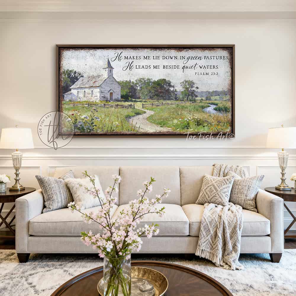 This Psalm 23:2 vintage landscape painting by Toe Fish Art captures spiritual peace through a rustic countryside pastoral church scene, featuring farmhouse cottagecore aesthetics with natural earth tones of soft greens, white, and blues. Be surrounded by decor you LOVE! Choose premium framed canvas or durable outdoor metal. Toe Fish Art makes artisan wall art with American materials. Proudly Made in the USA, each piece is expertly constructed with genuine craftsmanship, heritage quality, and rustic charm.